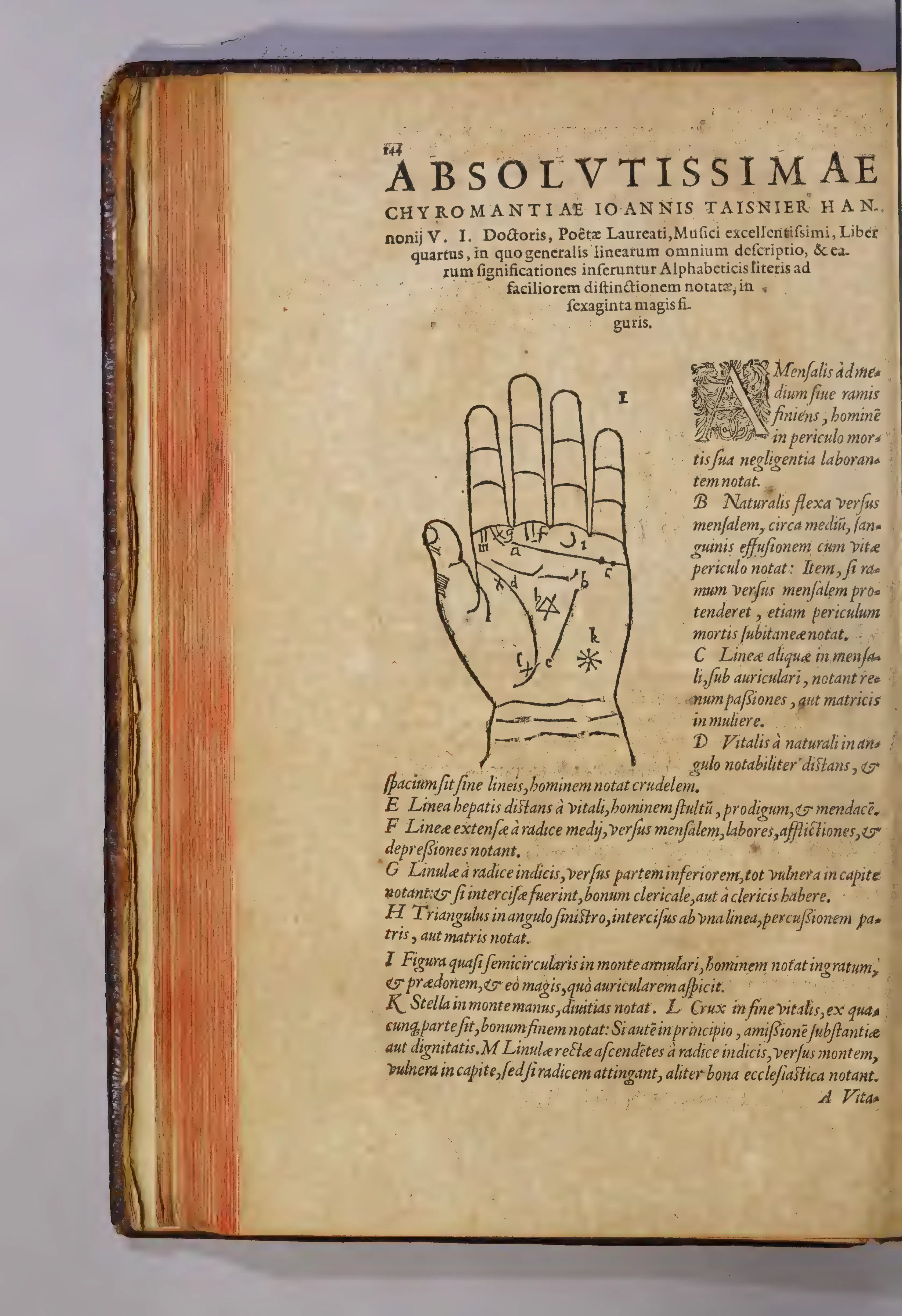 Book IV opens with a display heading announcing Taisnier's credentials before a woodcut palm keyed to a column of glosses.