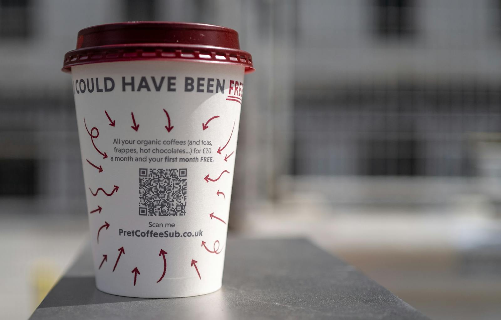 A coffee cup with a QR code on it.