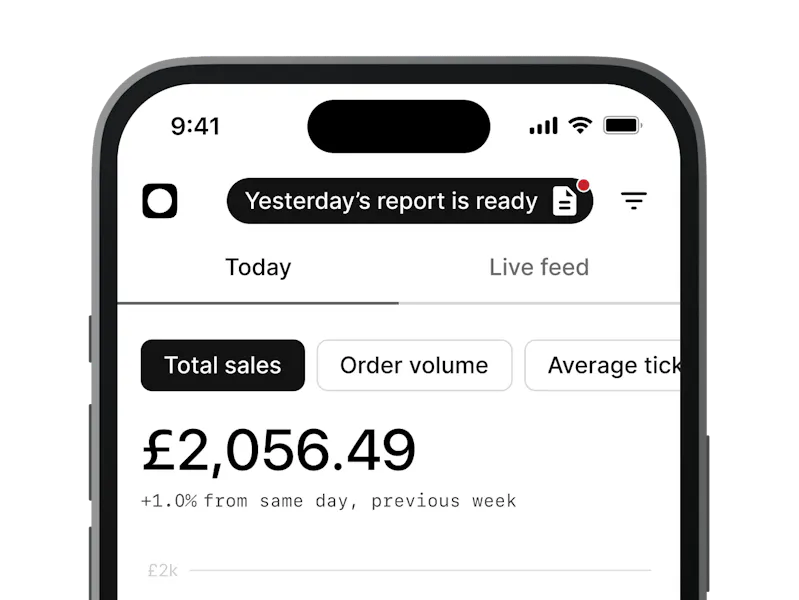 An image of the top half of a black mobile phone displaying Total sales on screen