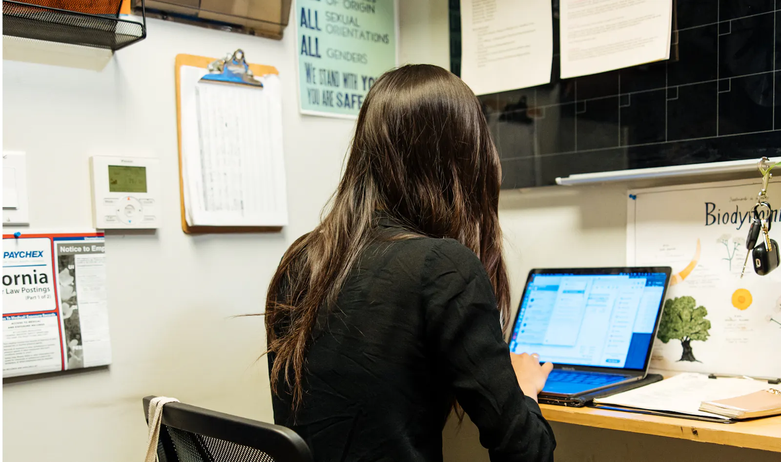 A restaurant owner viewing data from a multi-channel POS system.