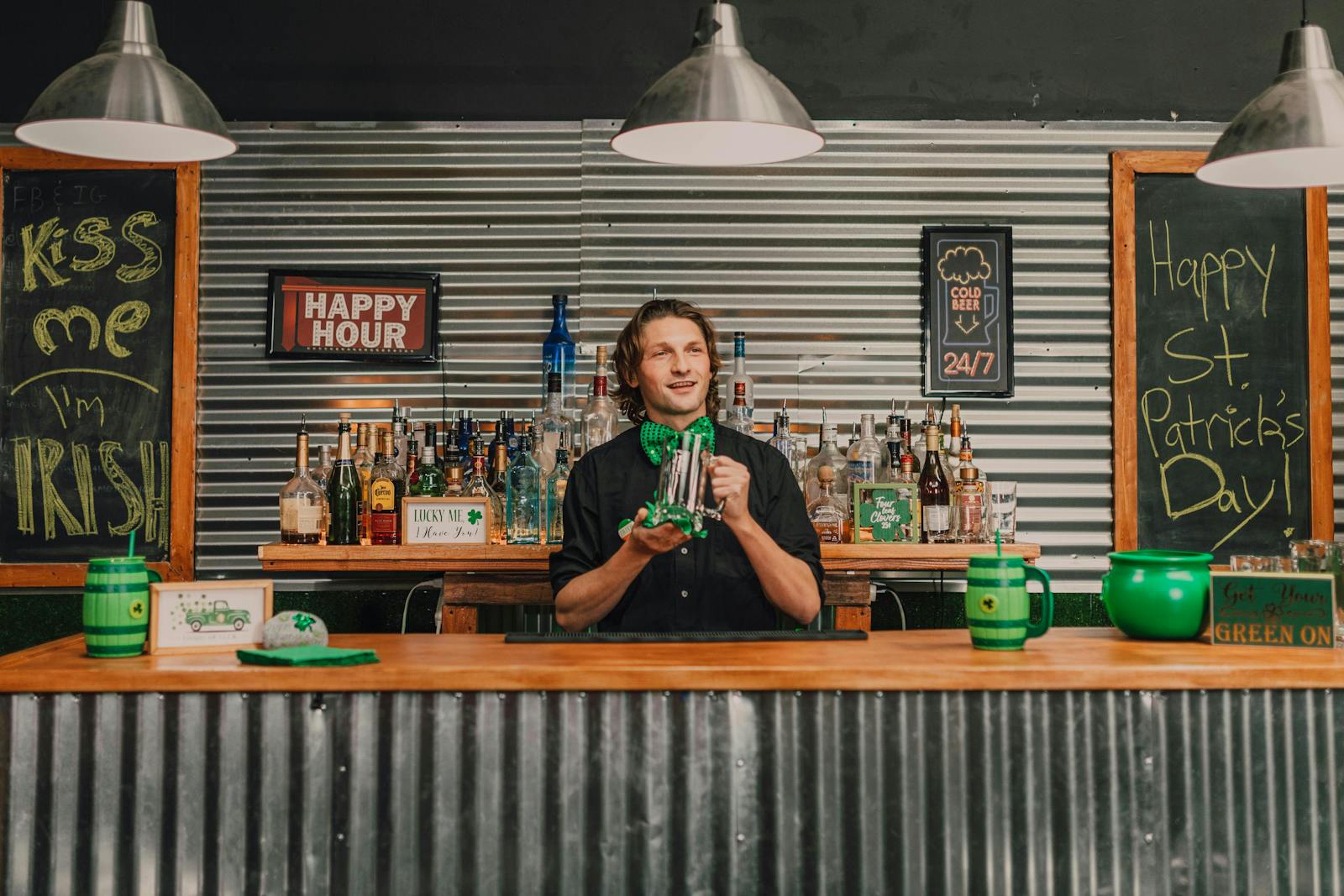 A bartender at a restaurant on St. Patrick's Day. 