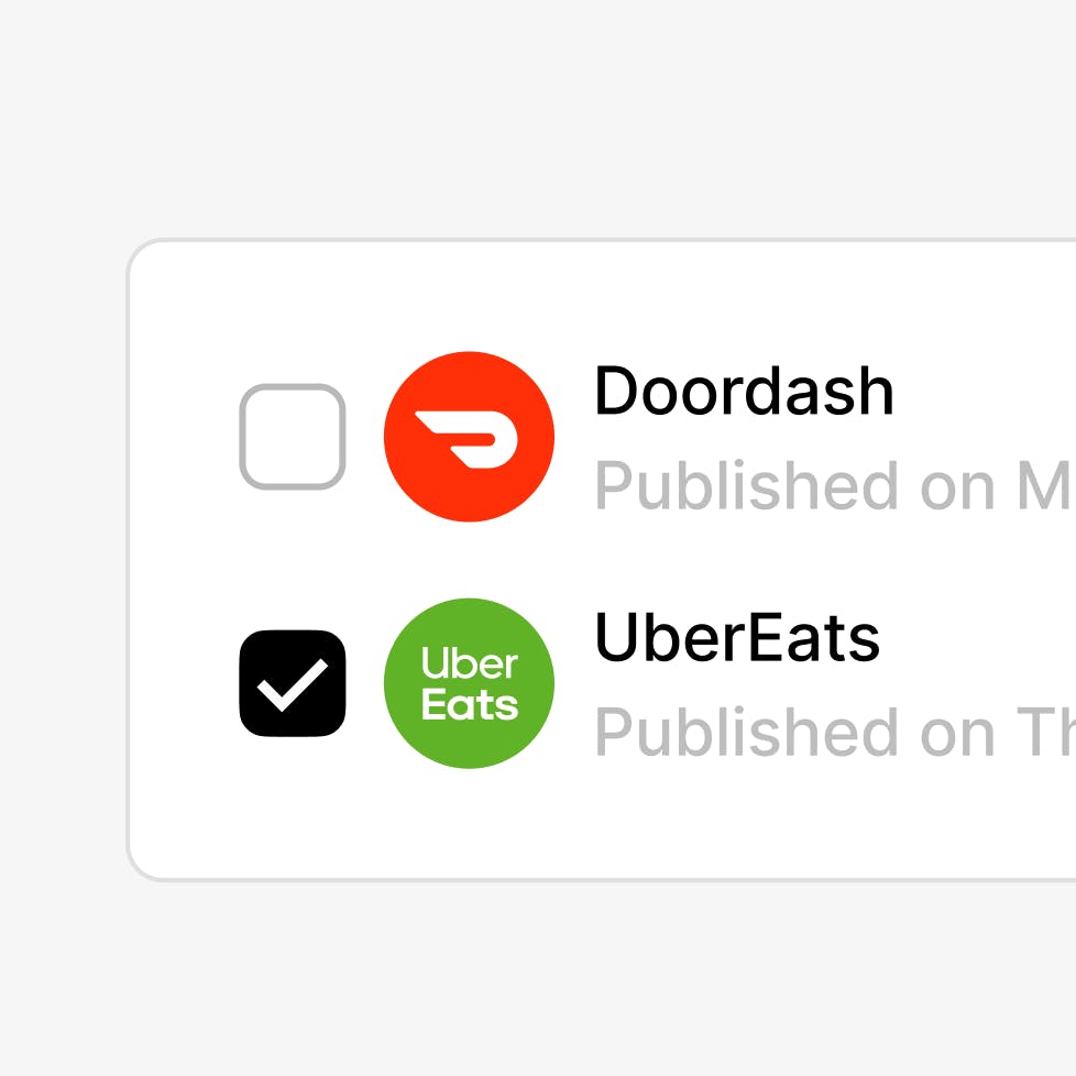 Black and white checkmark next to green and white Uber Eats icon