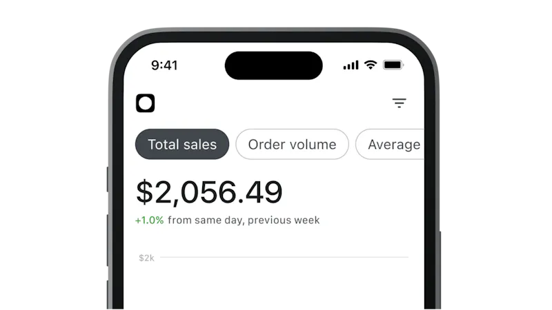 An image of the top half of a black mobile phone displaying Total sales on screen