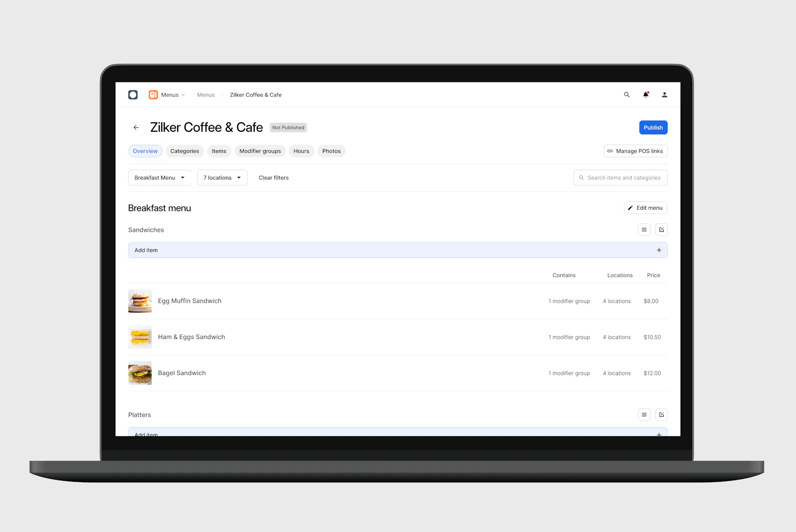 Laptop displaying menu manager interface on screen