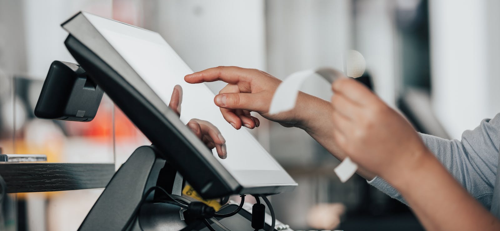 A restaurant owner using a POS system. 