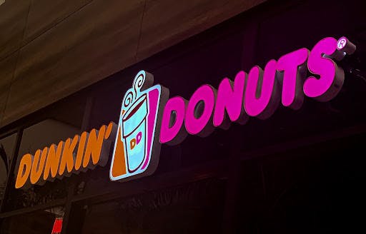 Dunkin' Donuts Franchise logo in neon sign. 