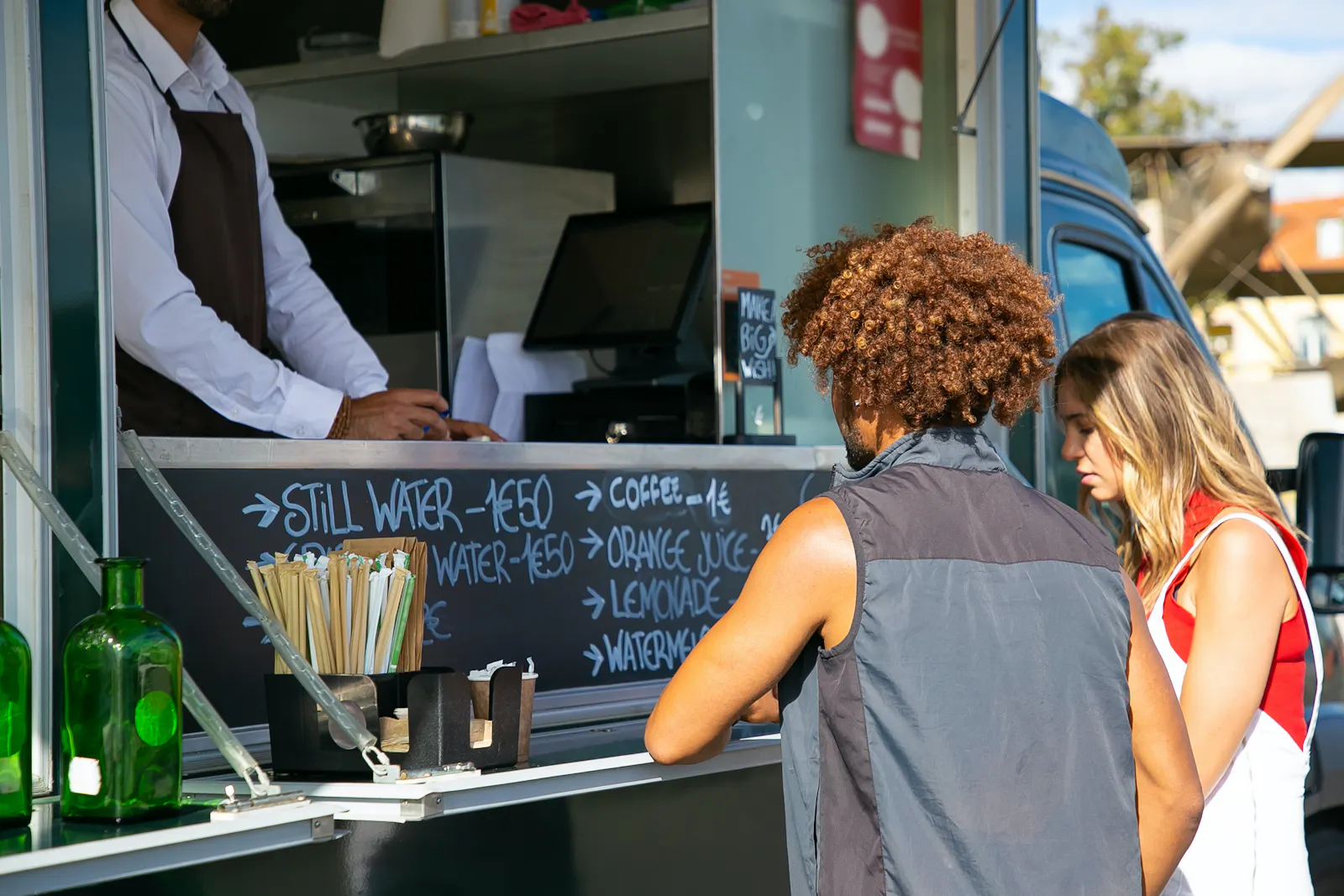 Customers using software at a food truck.
