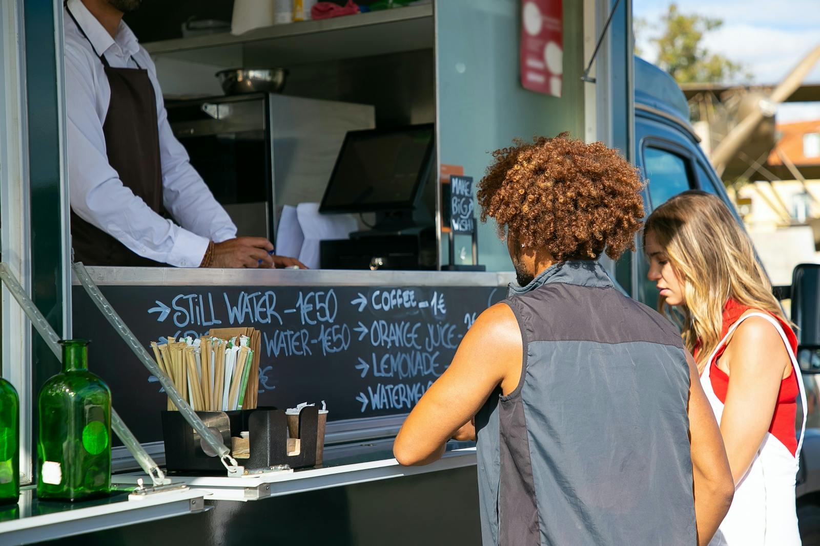 Customers using software at a food truck. 