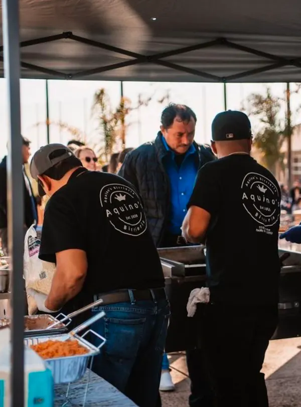 Customers being served at Aquino's Birrieria. 