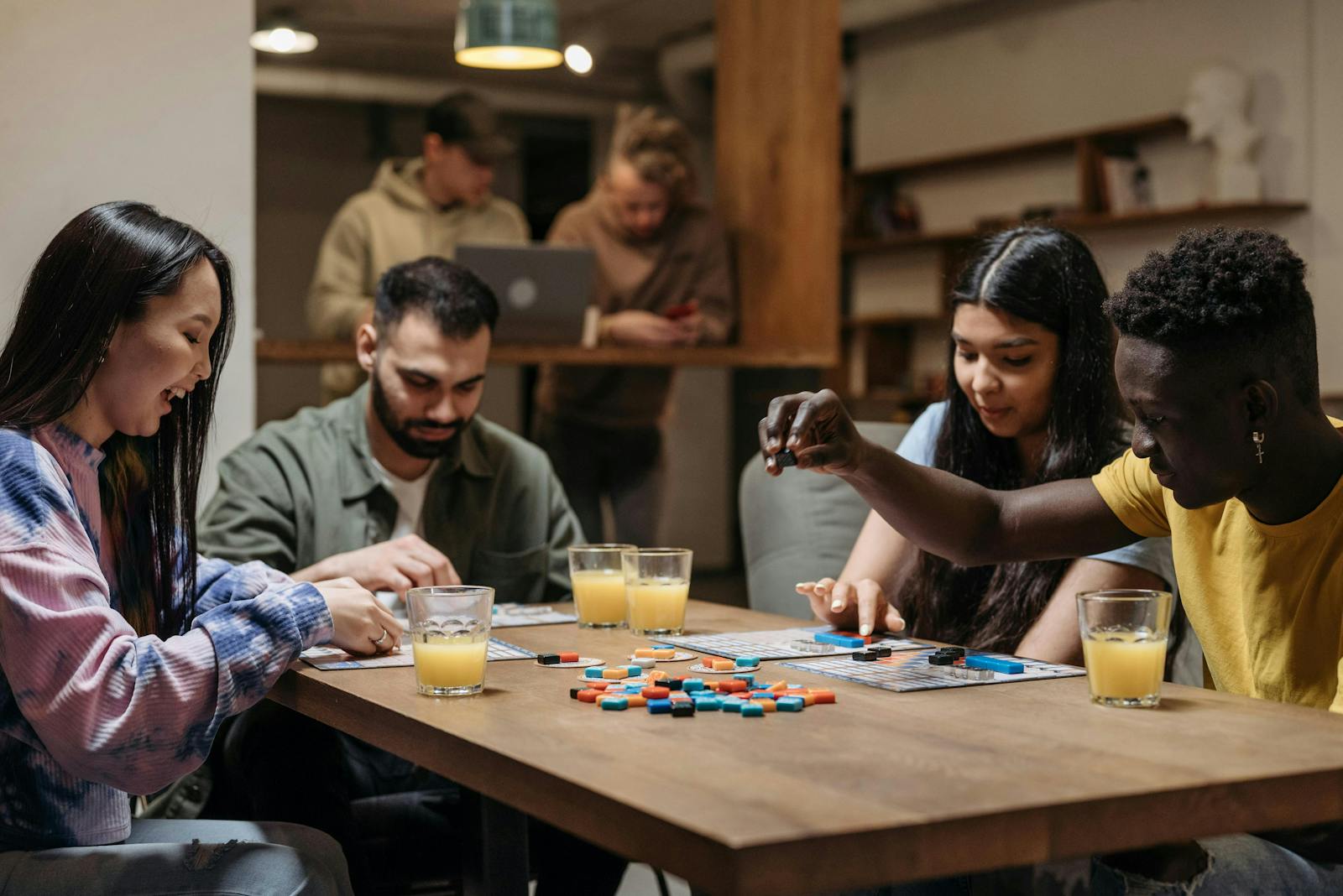 Customers playing a board game at an eatertainment restaurant.