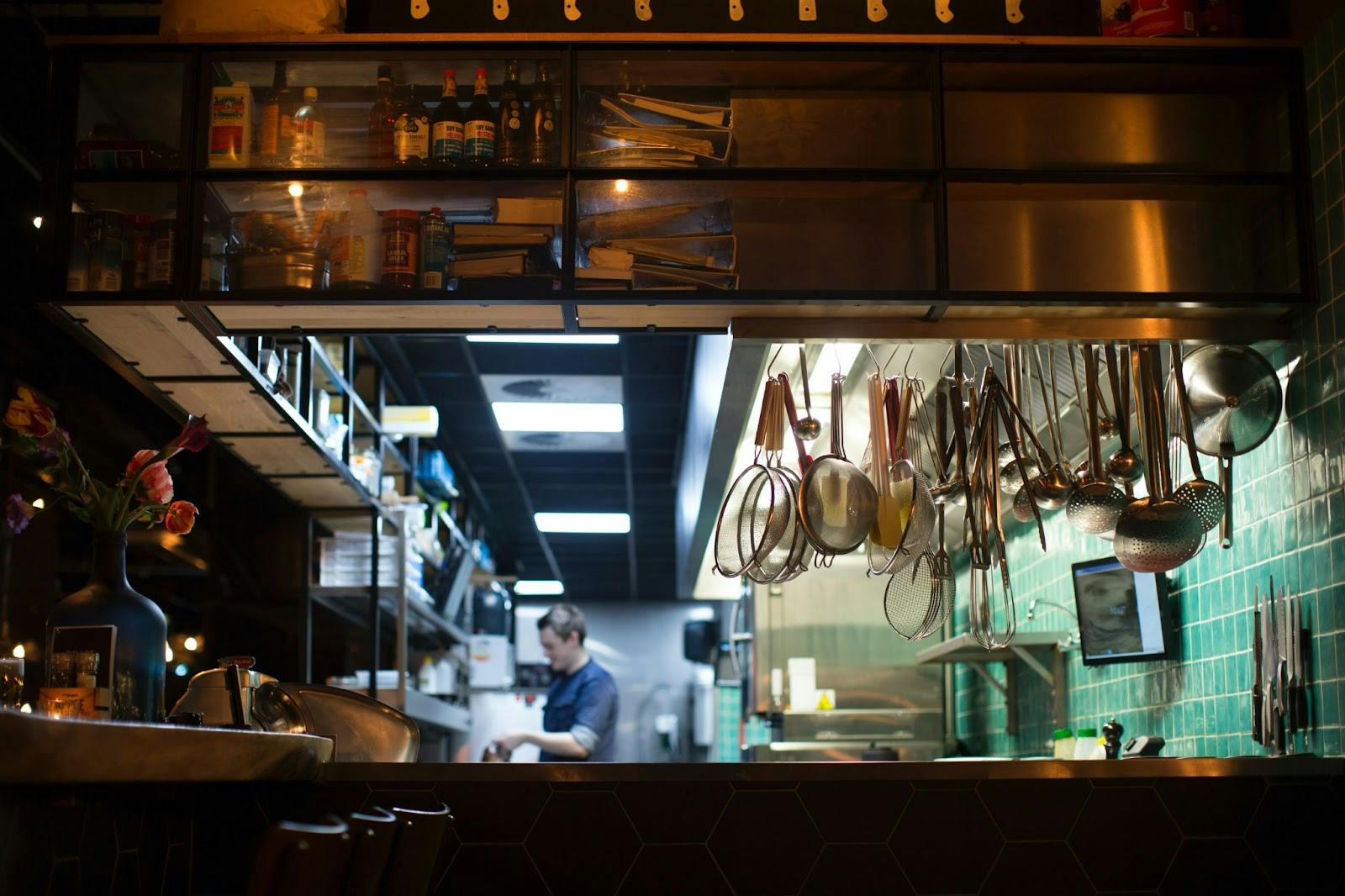 Image of kitchen equipment hanging over an open counter