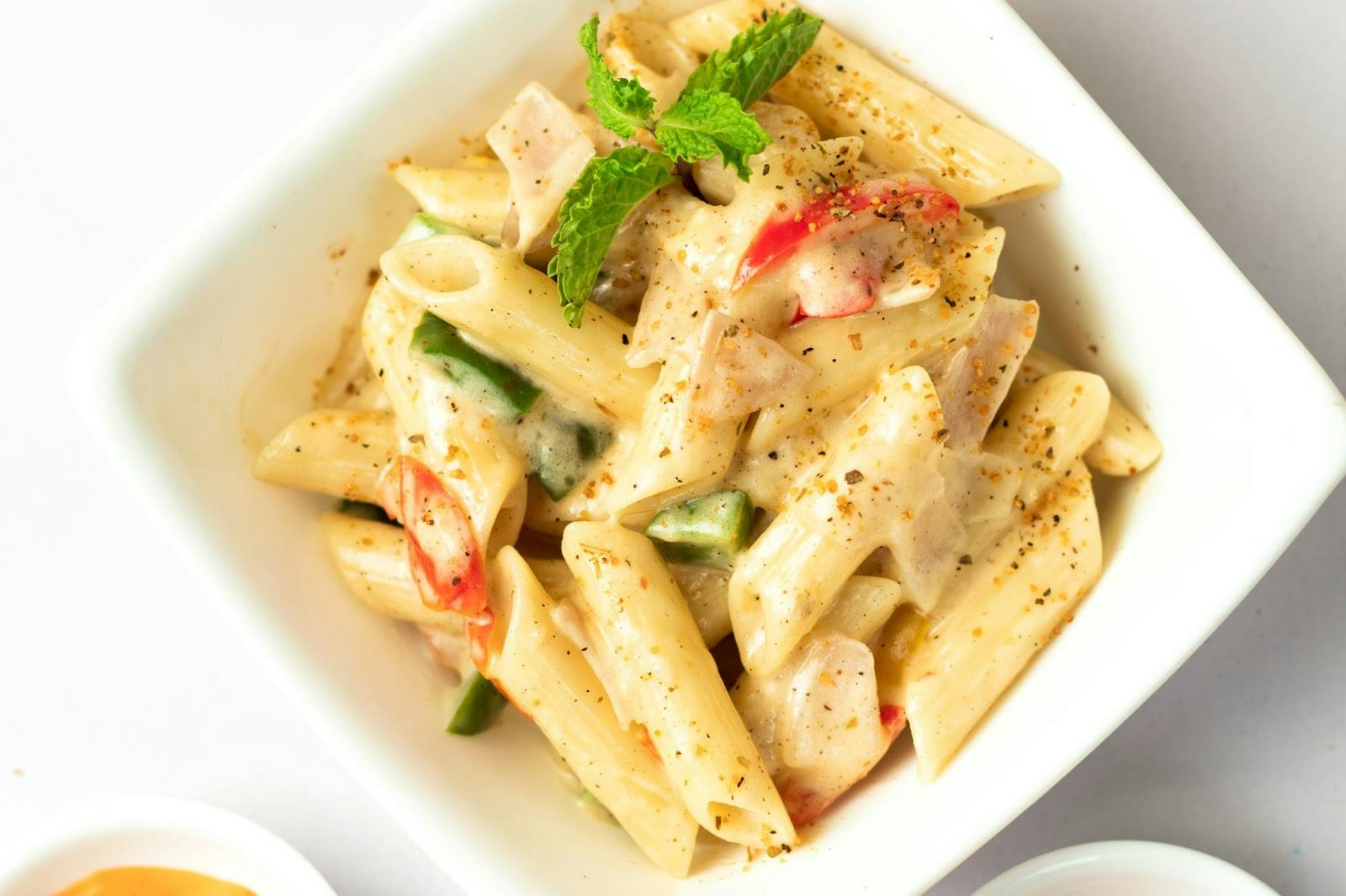 Image of a penne pasta dish made with alternative milk