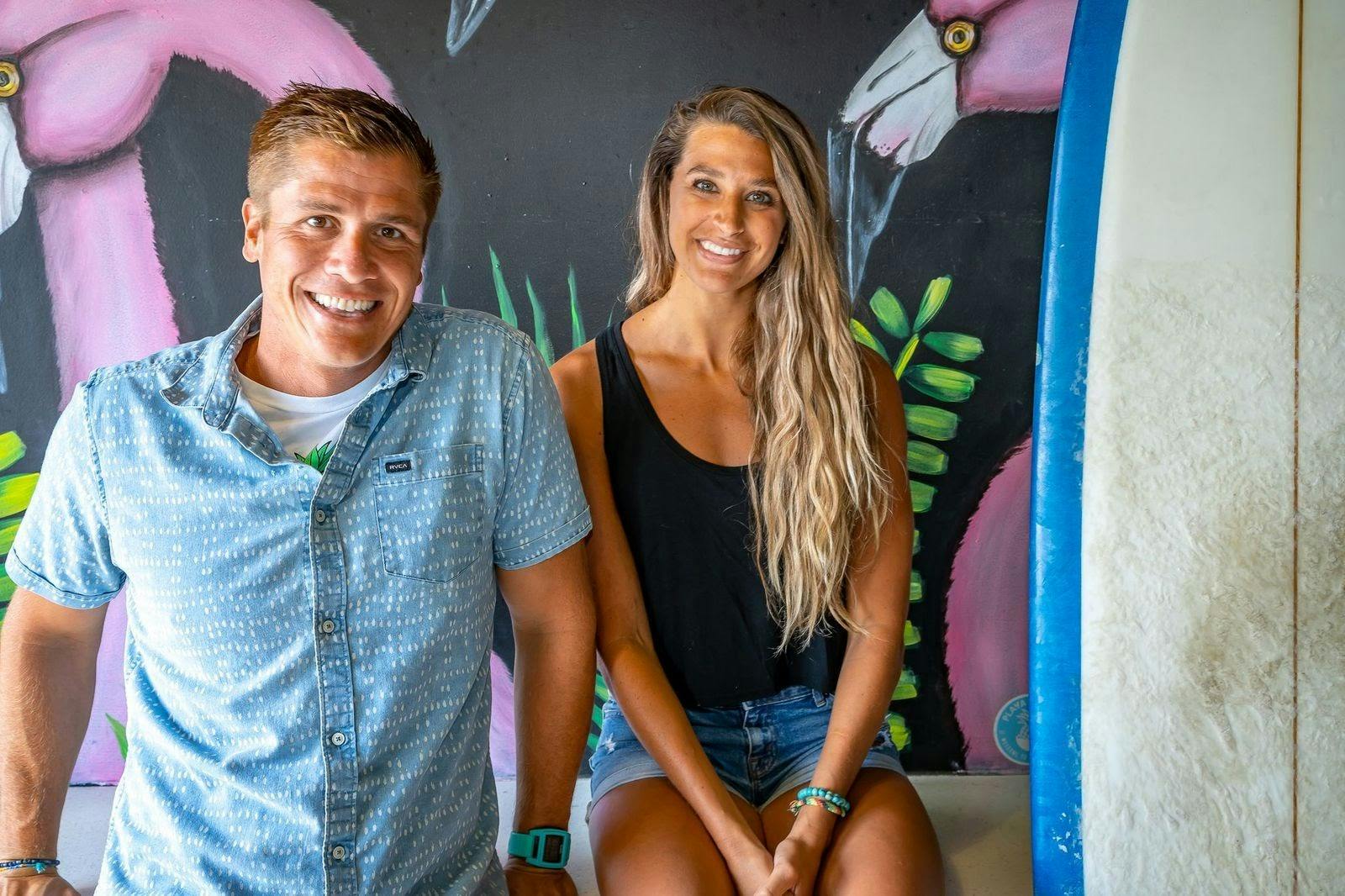 Playa Bowls founders Robert Giuliani & Abby Taylor smiling in one of their locations