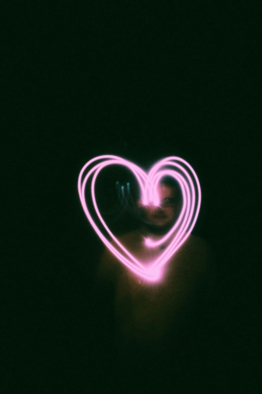 A neon heart with black background for Valentine's Day.