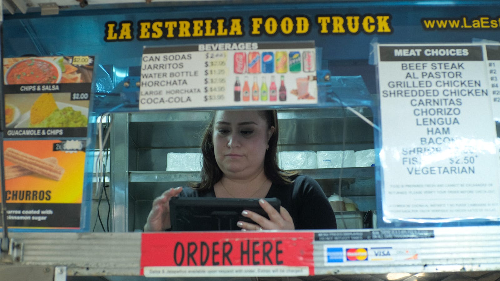 A food truck owner using a restaurant POS system. 