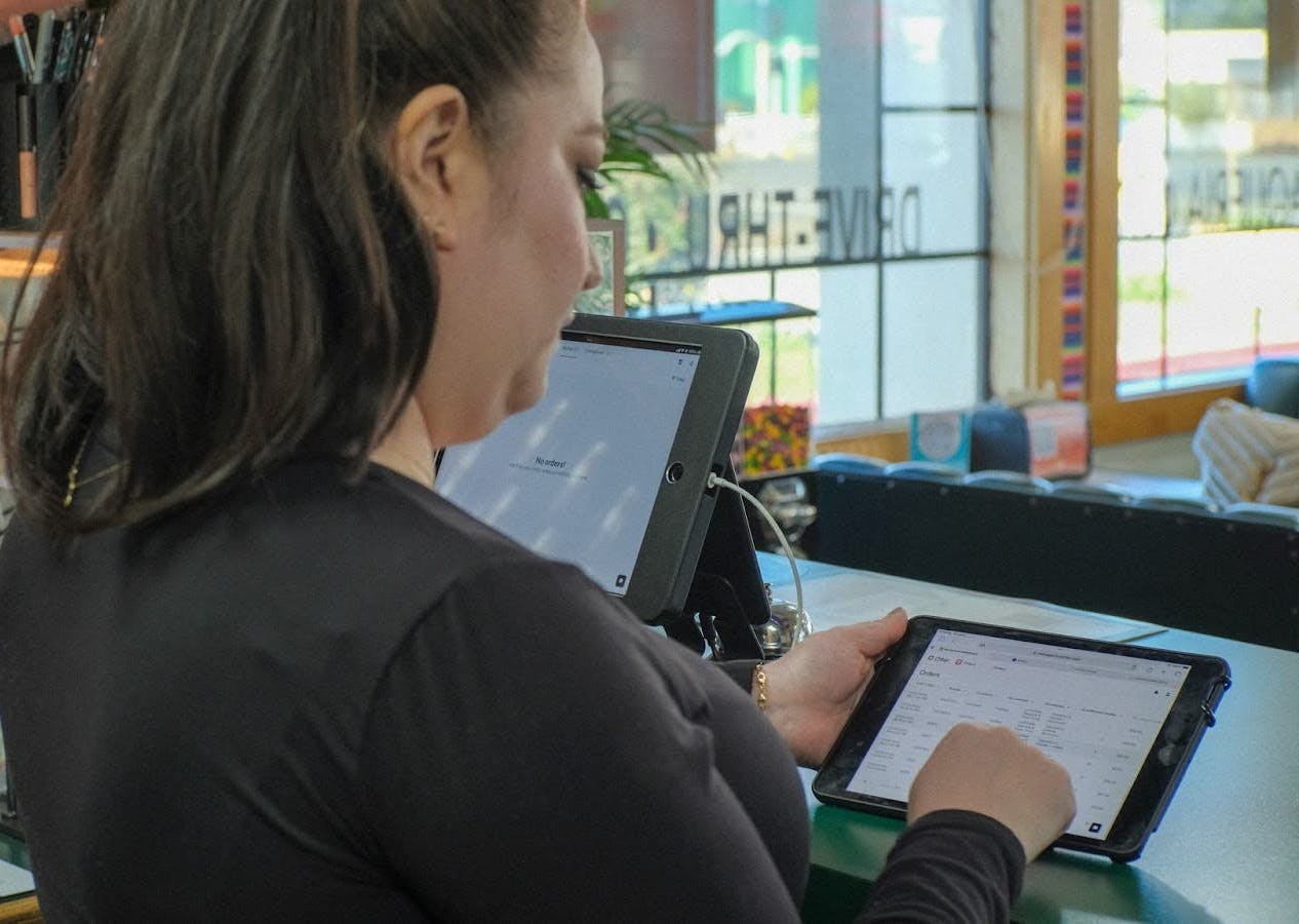 A restaurant owner using Otter POS. 