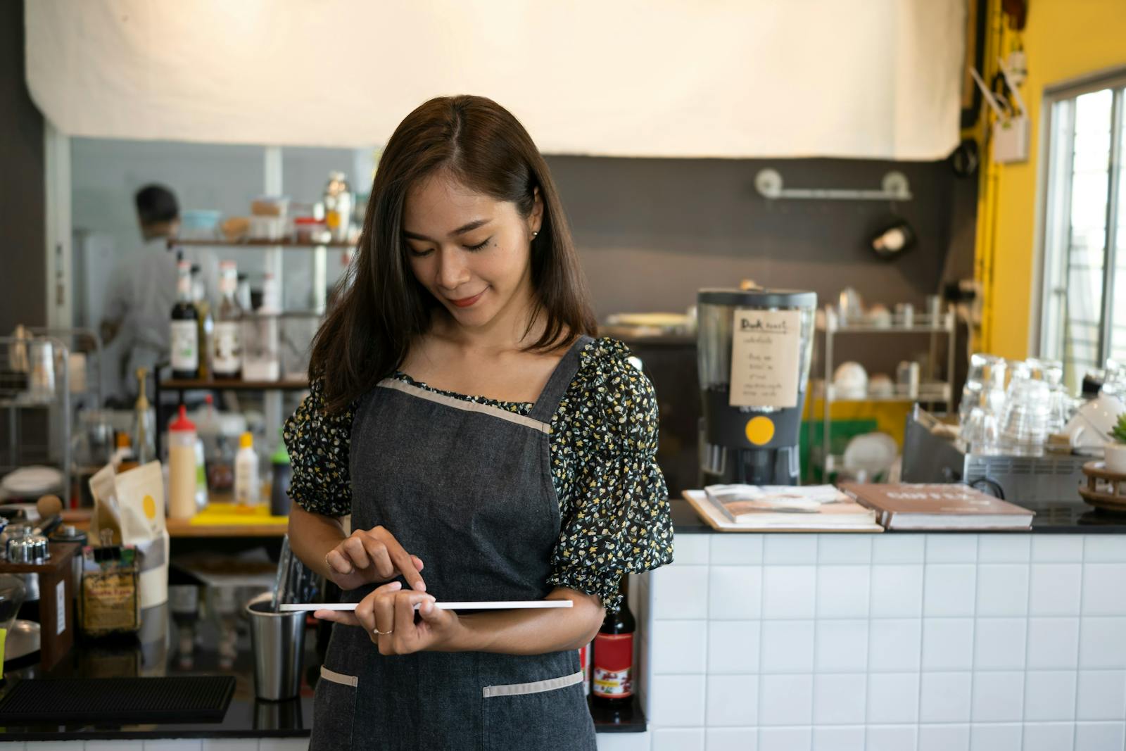An owner using a restaurant POS system. 
