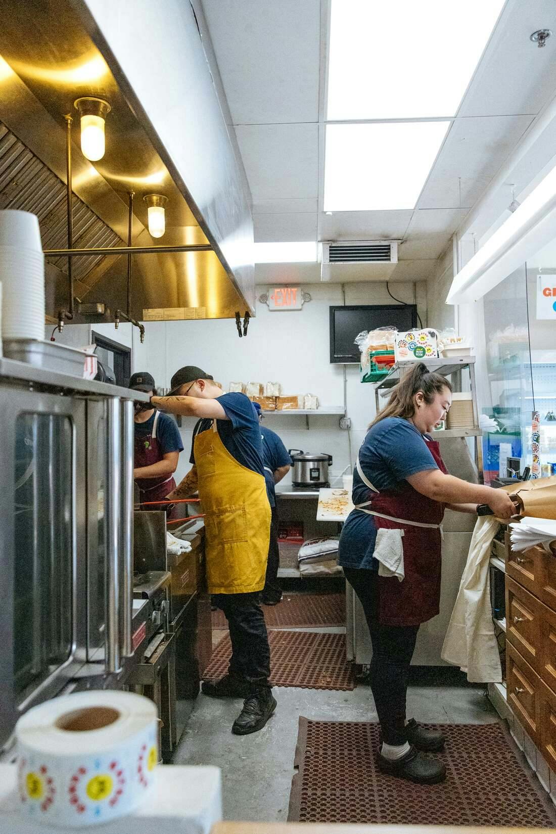 Image of restaurant workers in the kitchen
