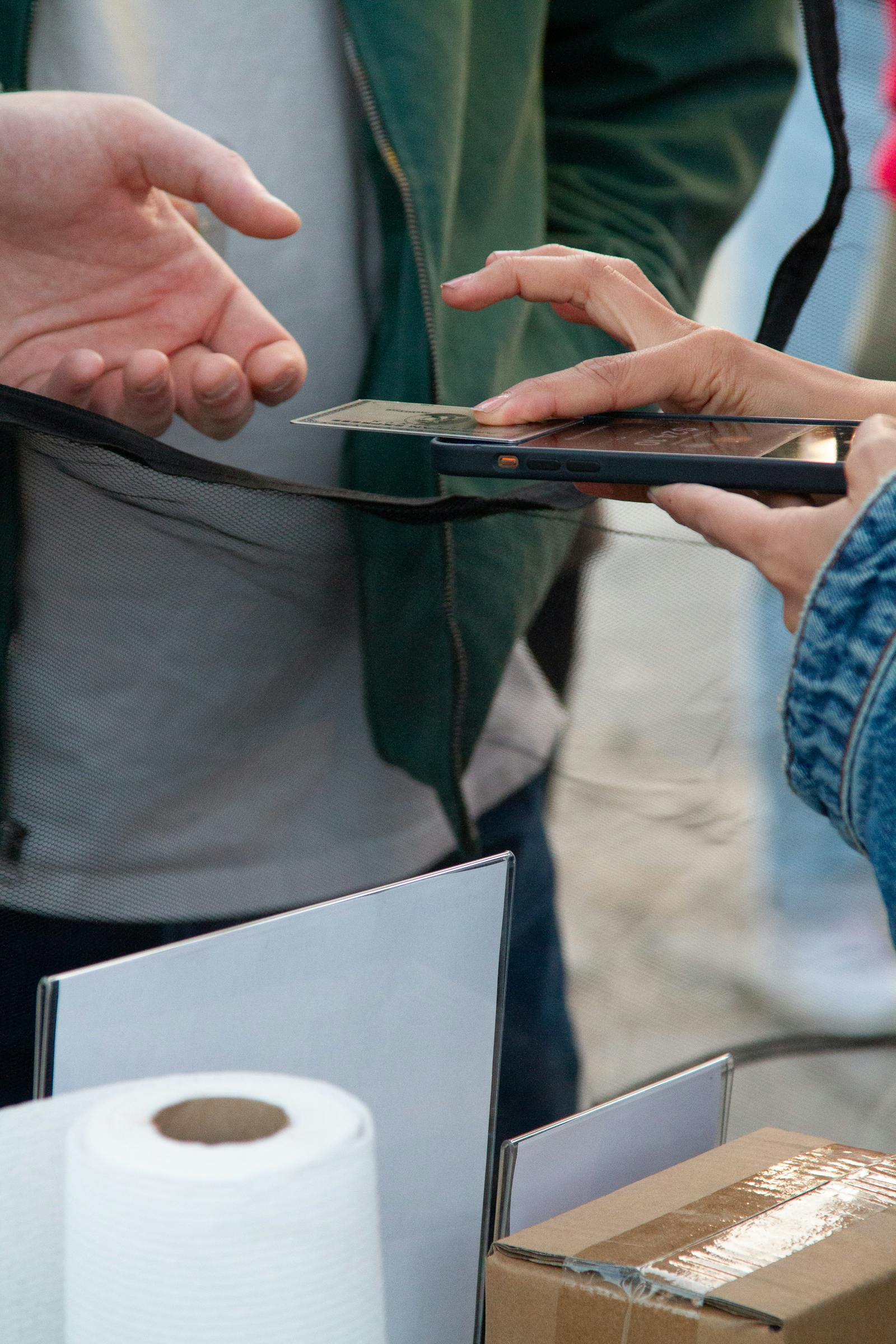 Image of restaurant customer tapping to pay