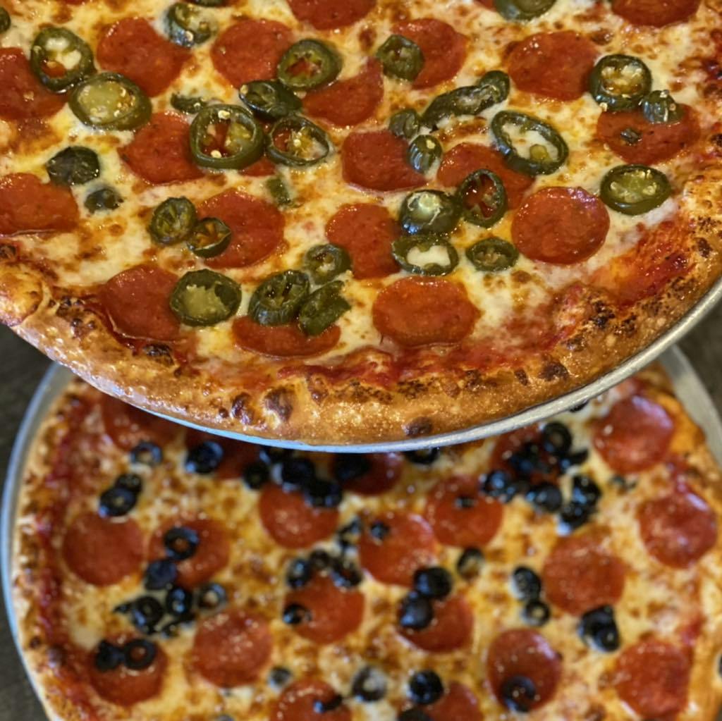 Image of a pepperoni & jalapeño pizza and a pepperoni and olive pizza from Floridino's