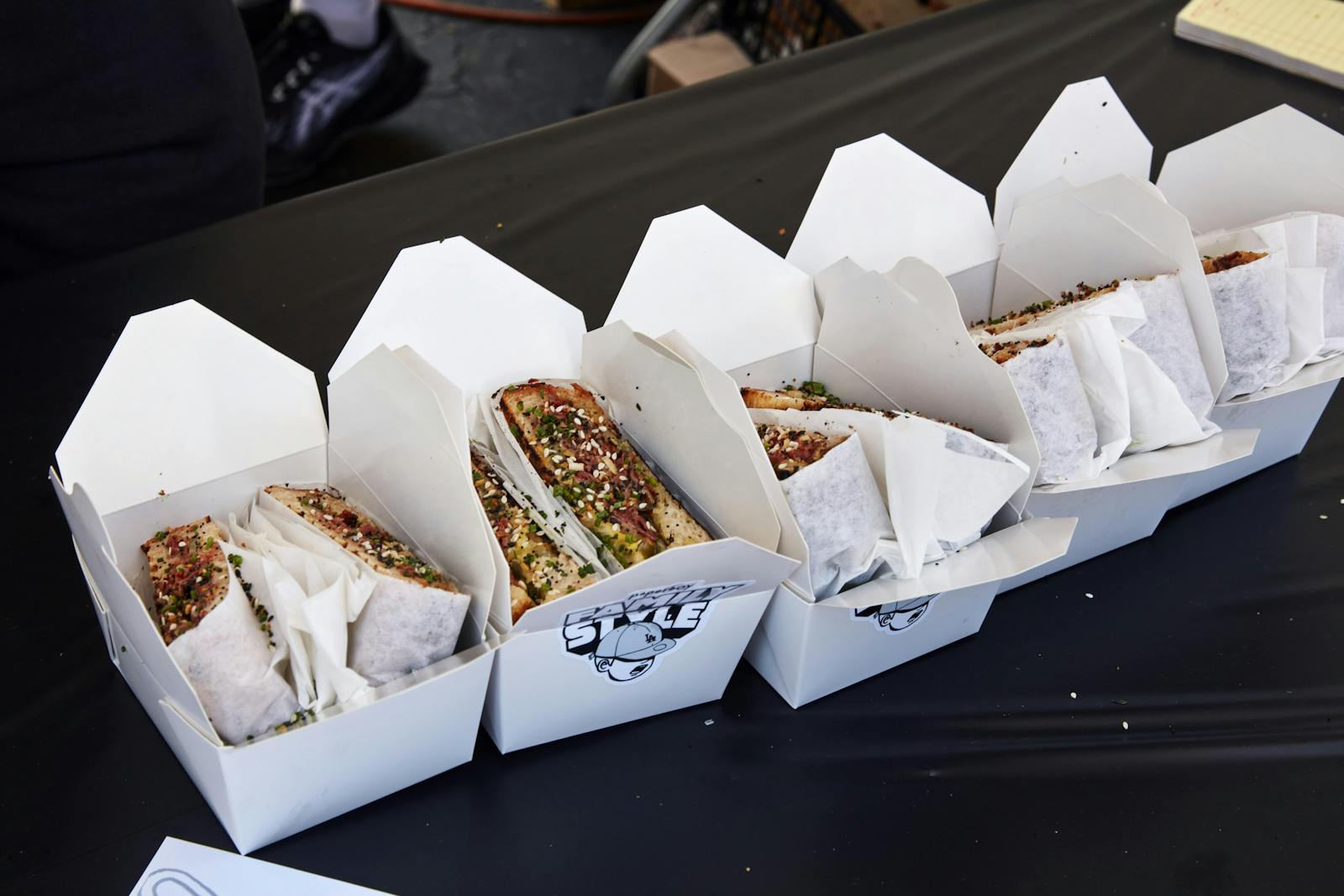 Image of sandwiches boxed up for to-go orders