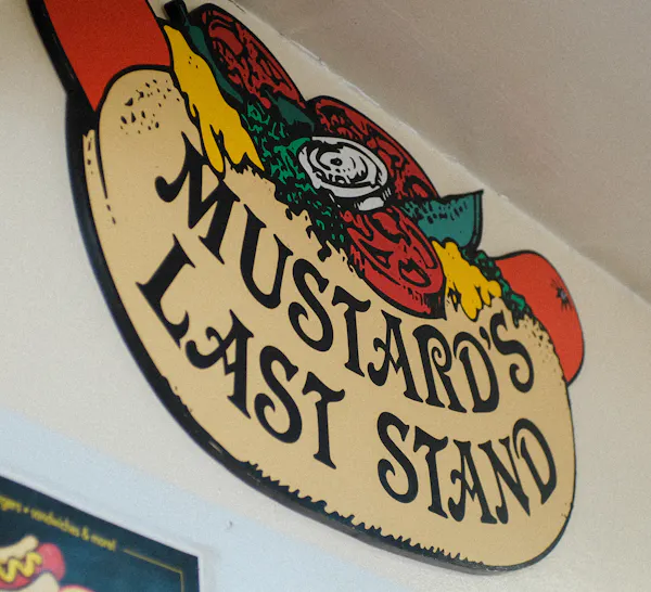 The logo of Mustard's Last Stand. 