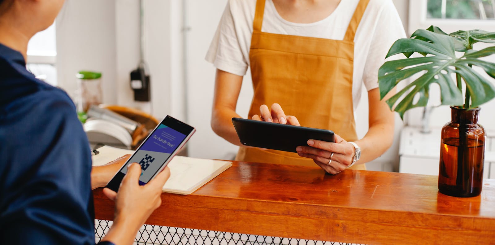 Restaurant customers and staff using QR codes.