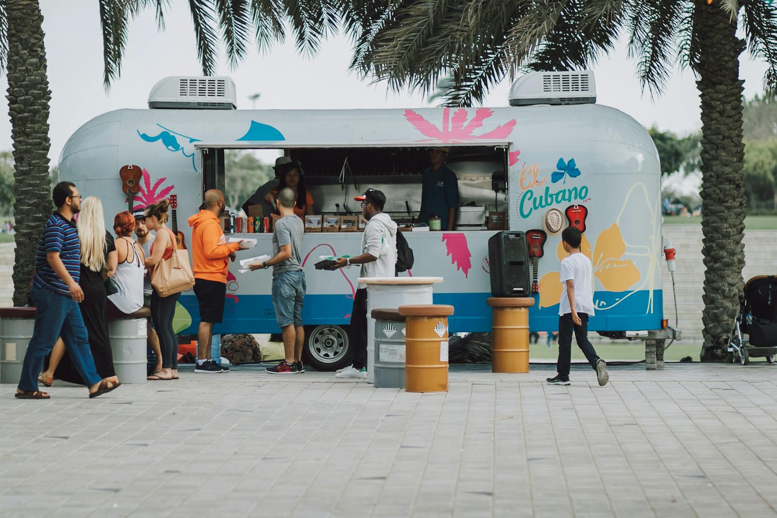 A food truck with plenty of customers. 