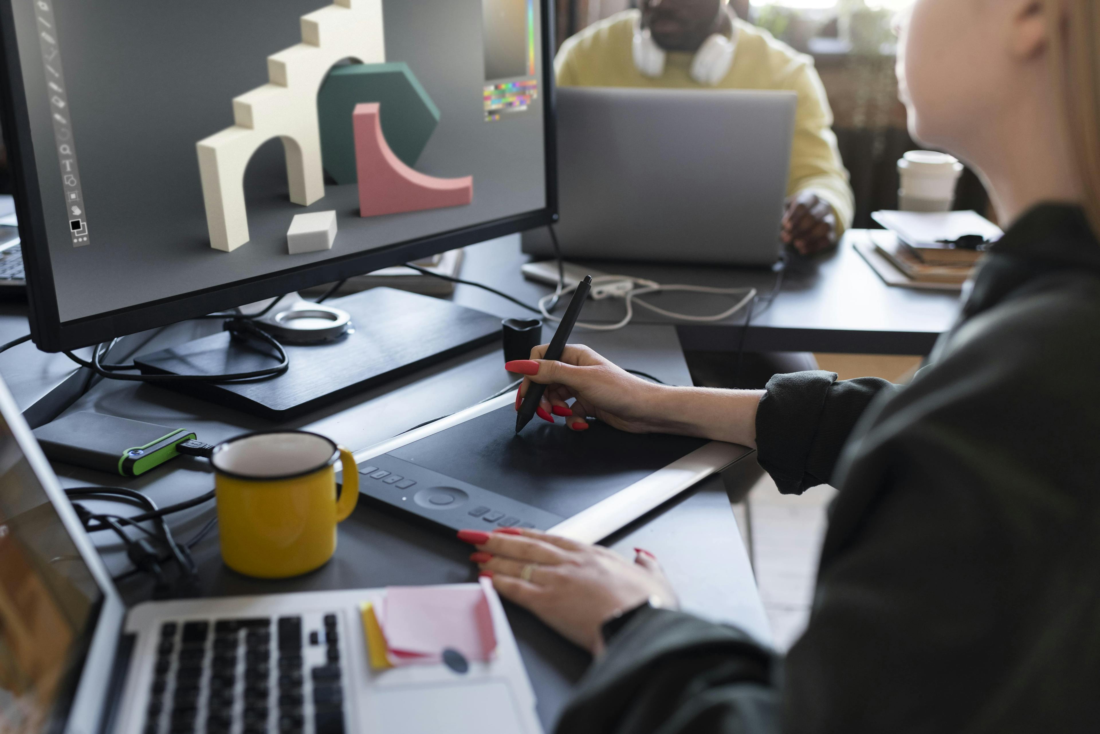 Designer working with tablet on 3D design