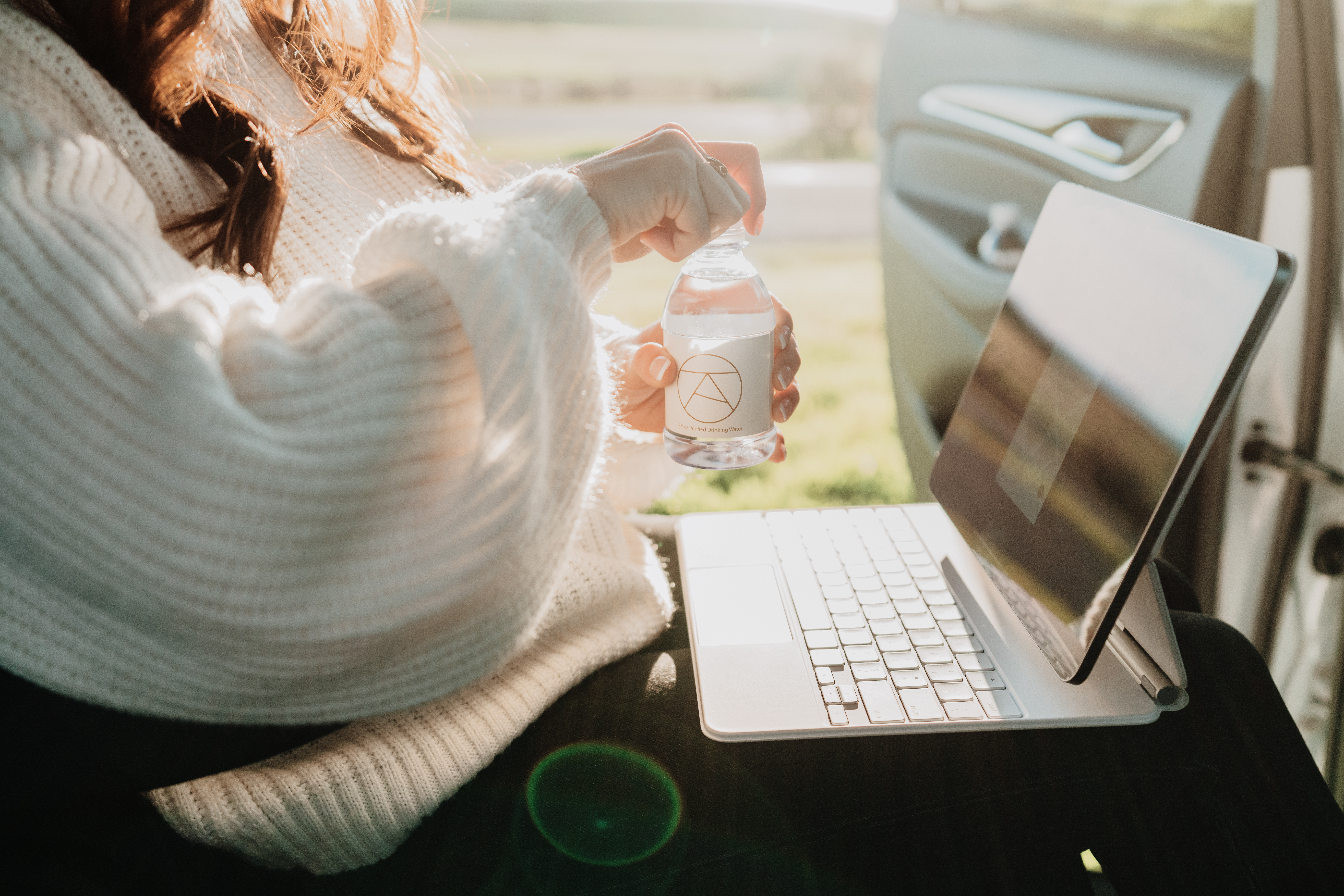 Female passenger sitting in an Alto ride share vehicle