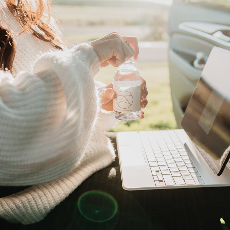 Female passenger sitting in an Alto ride share vehicle