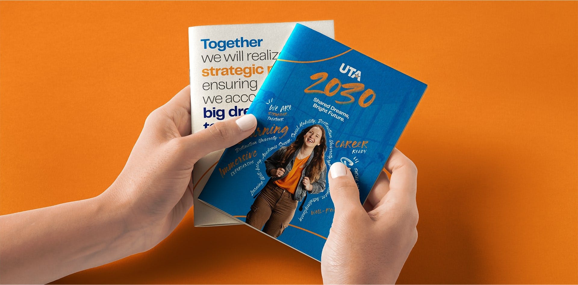 Hands holding brochures with "UTA 2030" branding and messages about shared dreams and bright futures on an orange background.
