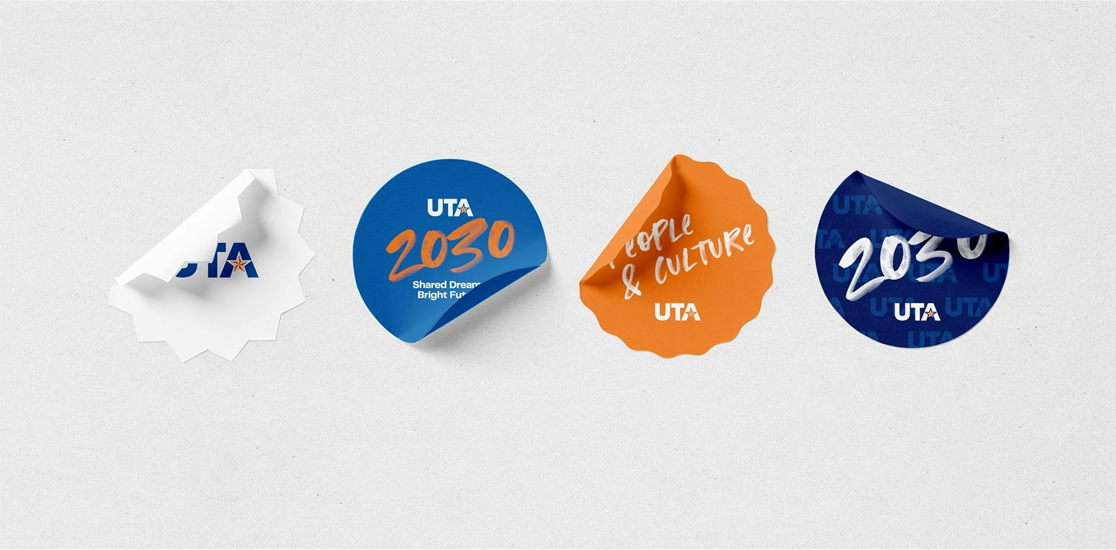 Stickers with the UTA logo and "2030" branding in blue and orange, with phrases like "Shared Dreams, Bright Future," and "People & Culture".