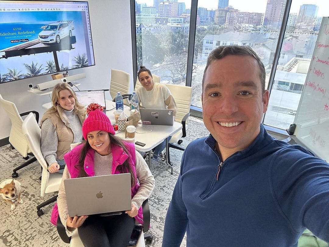 The uptown agency team, made up of three women and one man in this photo, work together to participate in brand strategy