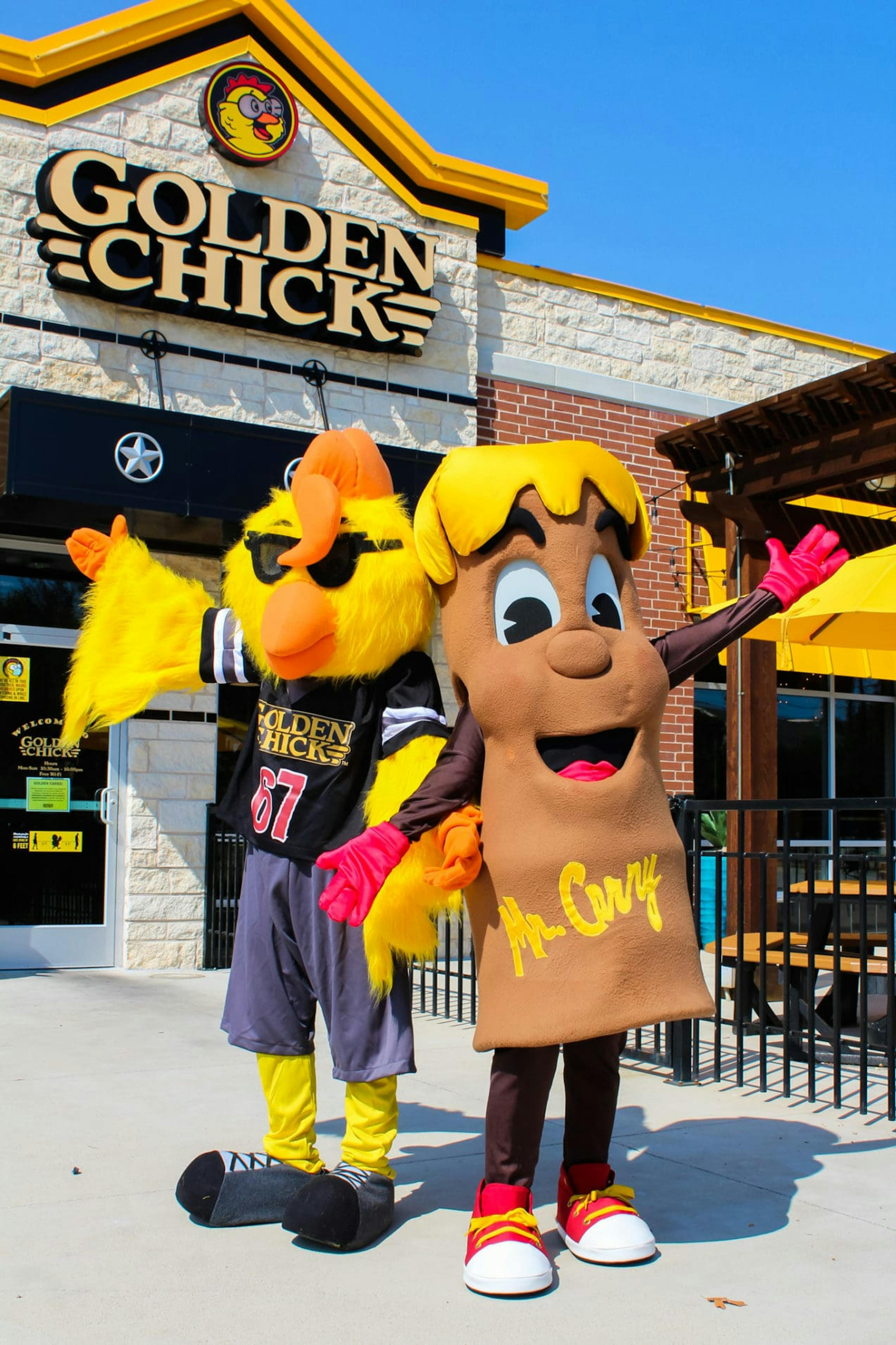 Golden Chick and Fletcher's mascots in front of Golden Chick location