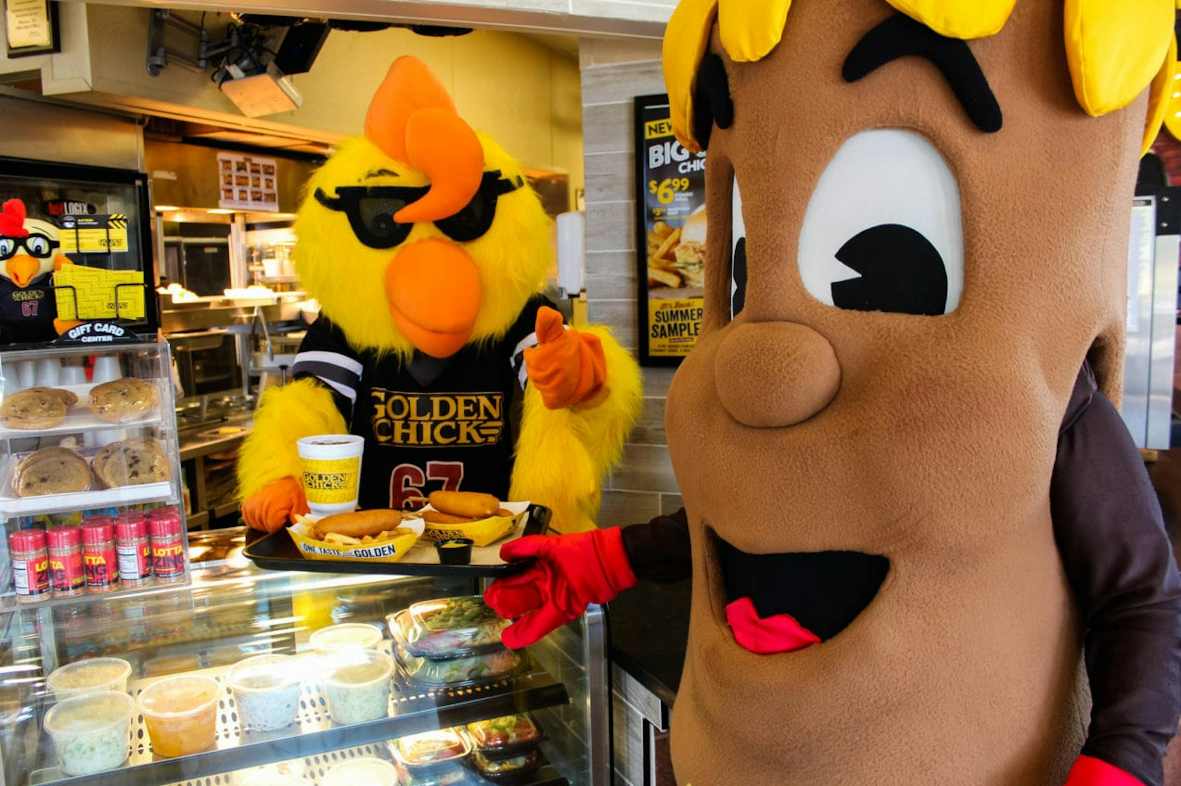 Flectcher's and Golden Chick mascots in Golden Chick store