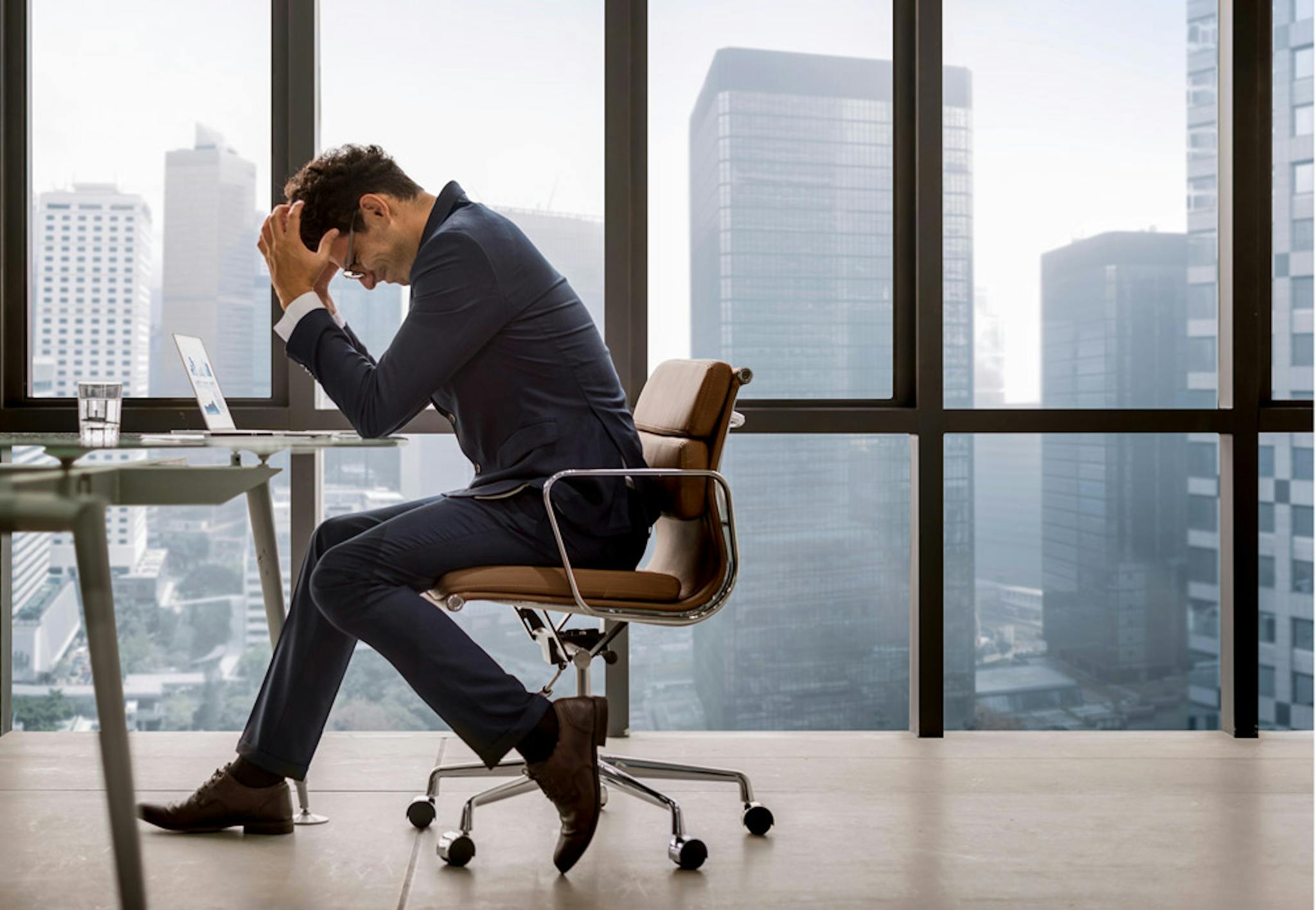 A frustrated marketer sitting at a desk