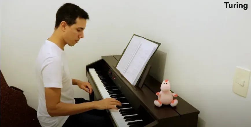 Franco sharing his Turing.com review and playing Piano