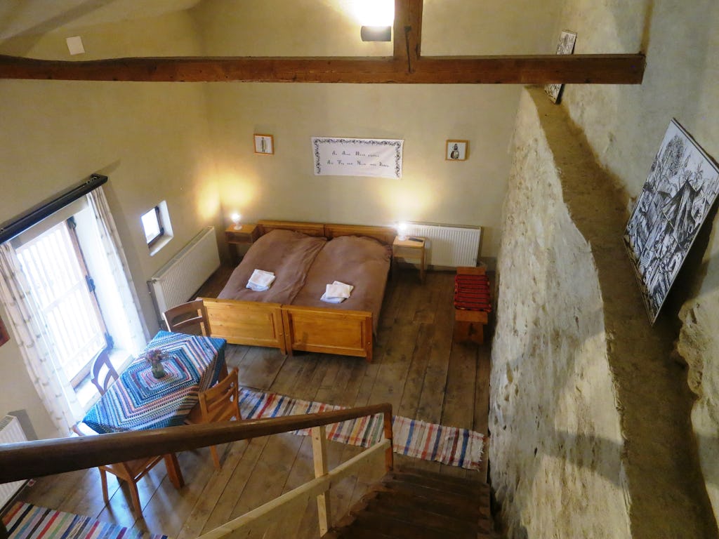 View of the medieval fortress wall with the two beds and table