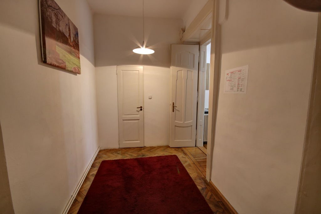Entrance to the apartment with red carpet