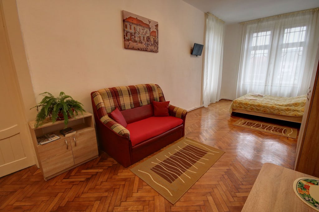 Extensible red sofa in the room