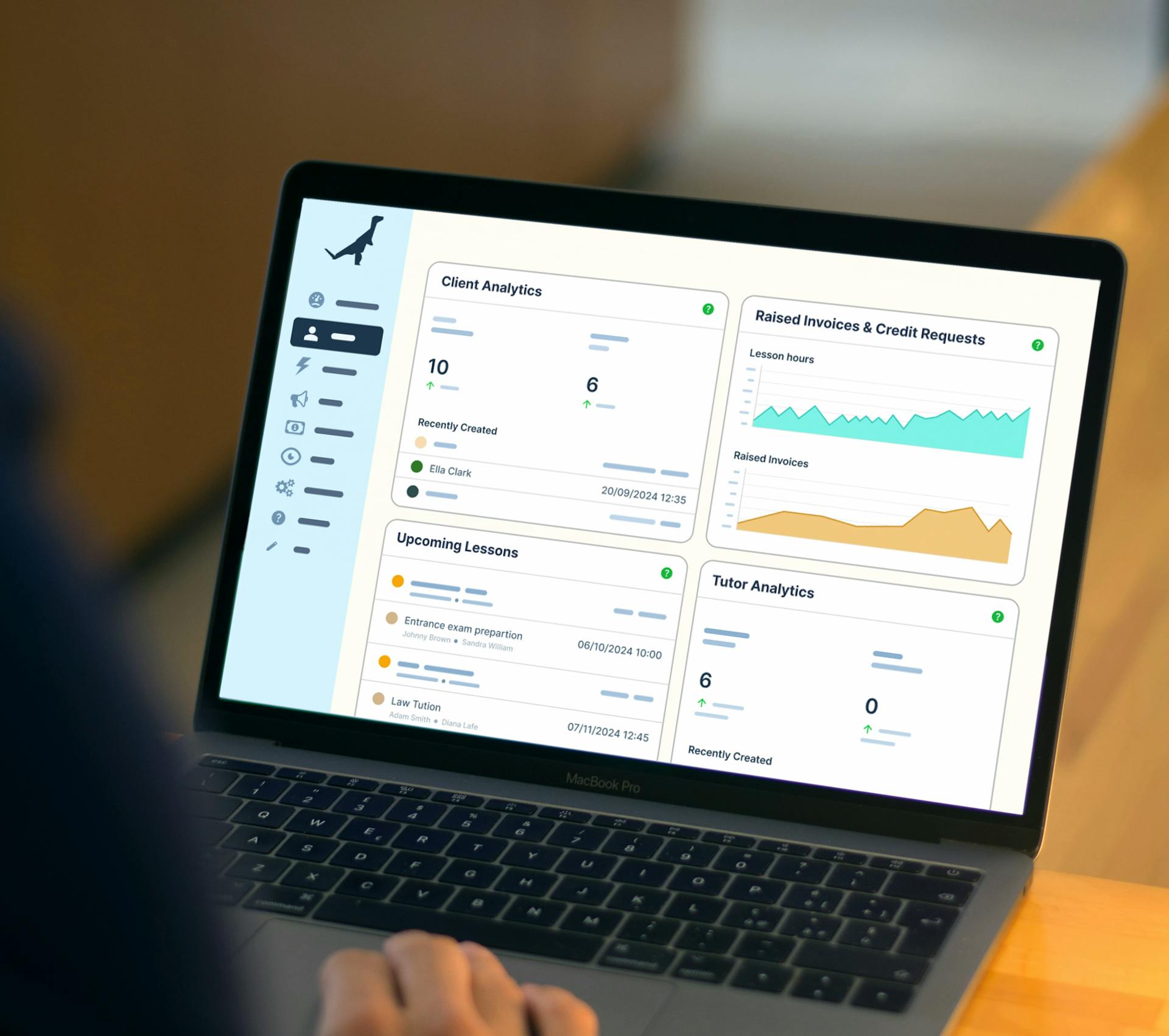 User viewing TutorCruncher’s analytics dashboard on a laptop, displaying client data, invoices, and lesson insights.