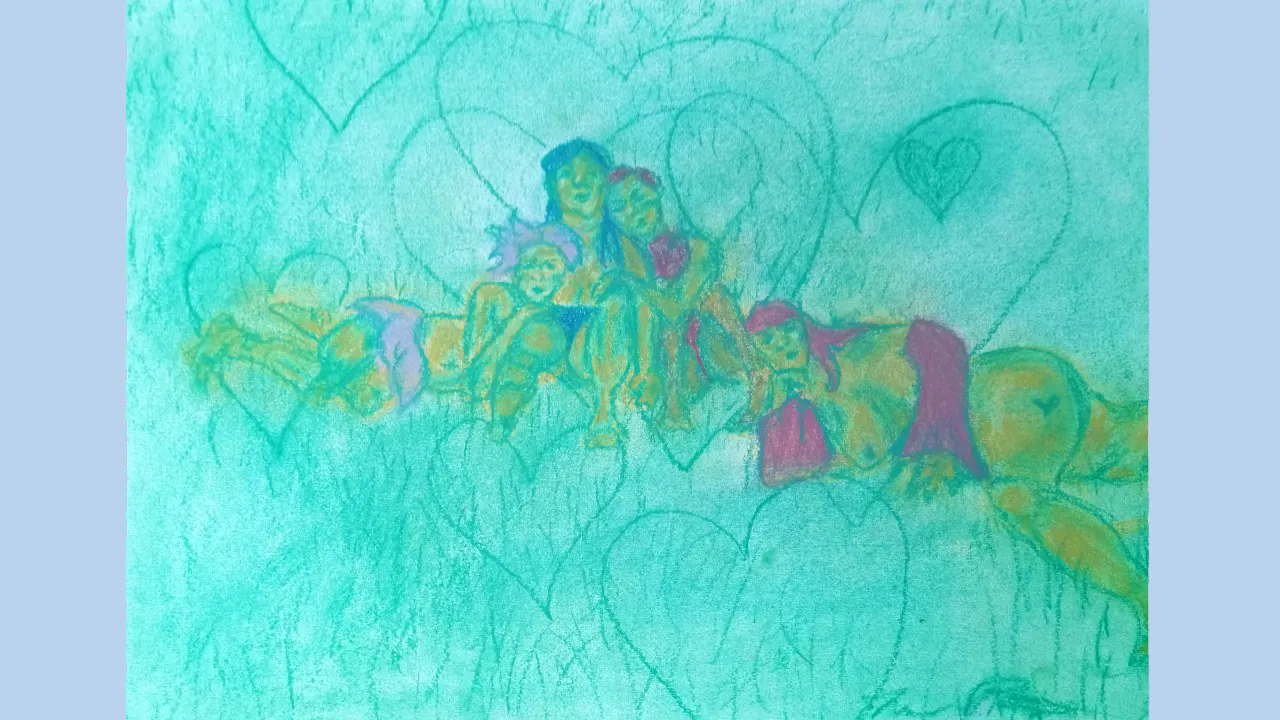 four people laying together on grass