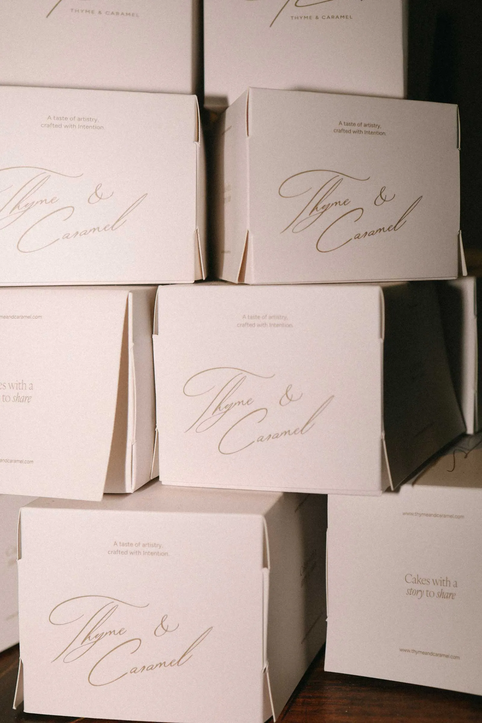 packaging designs stacked together for a high-end cakery