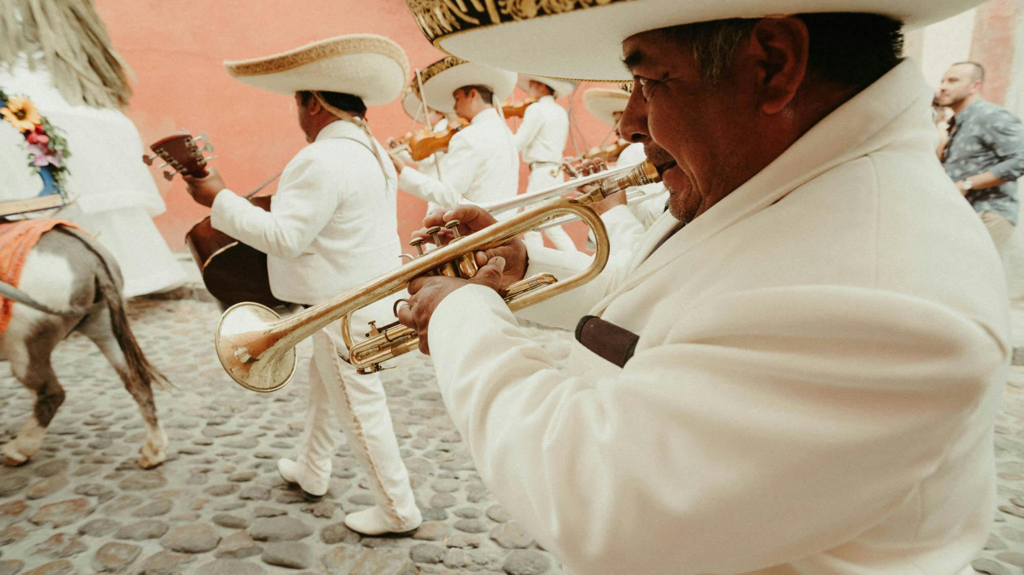 mexican parade with trumpets and donkey