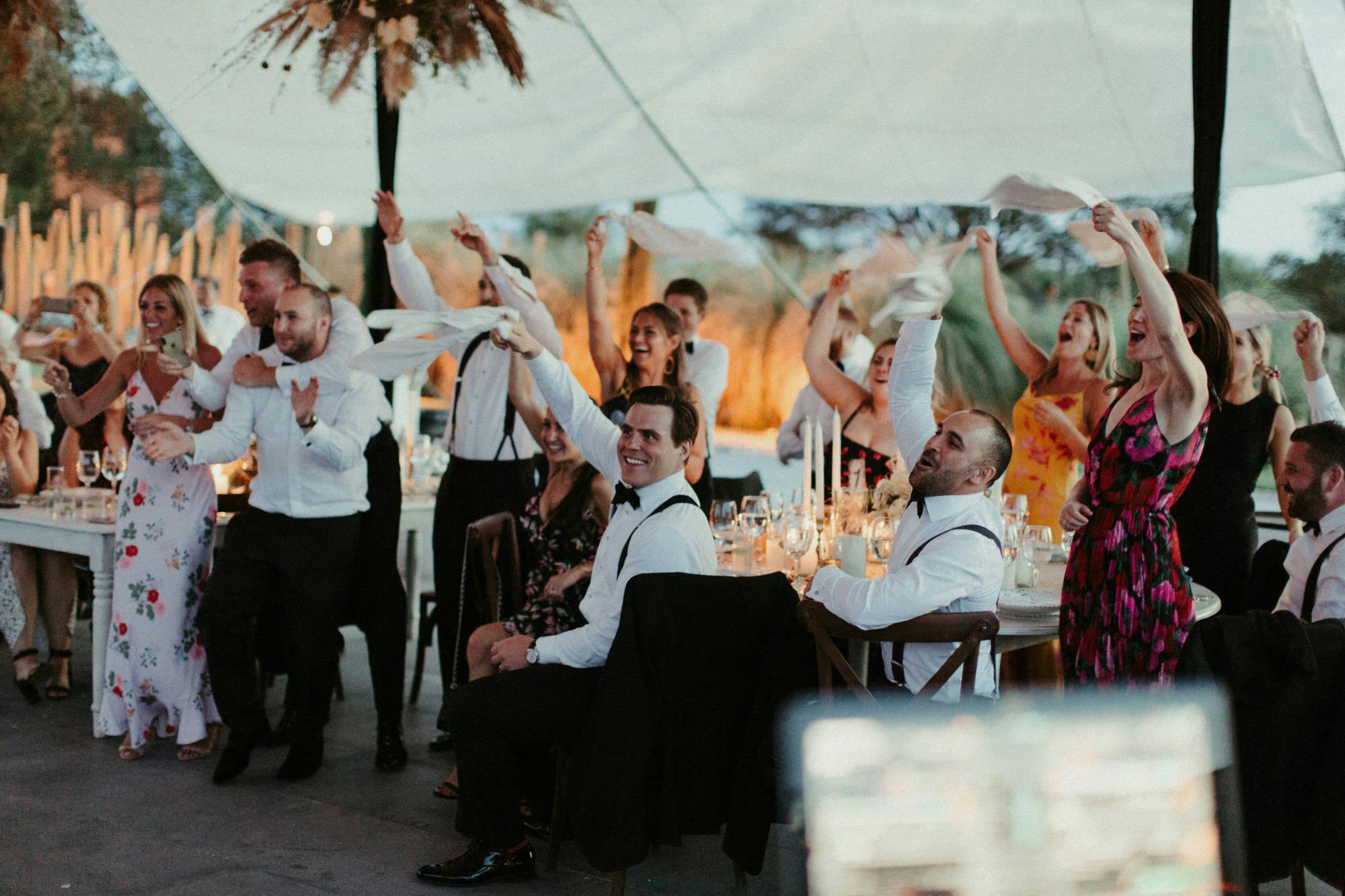 candid photojournalistic shots of guests cheering