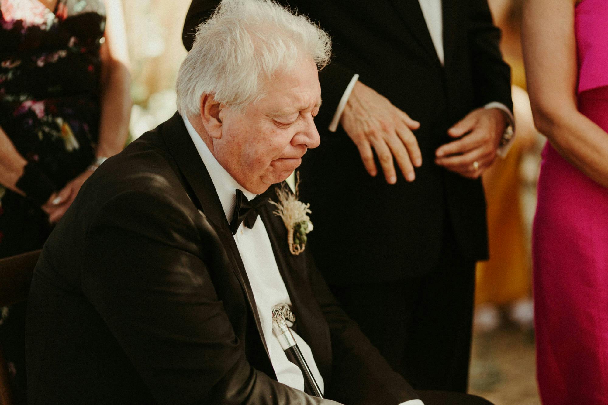 father of bride emotional at ceremony