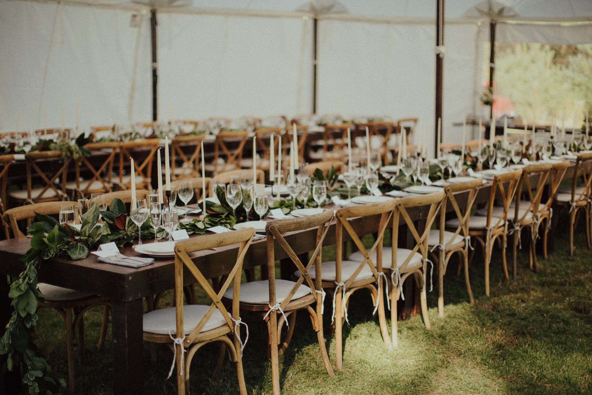 wooden benches with family style dinner