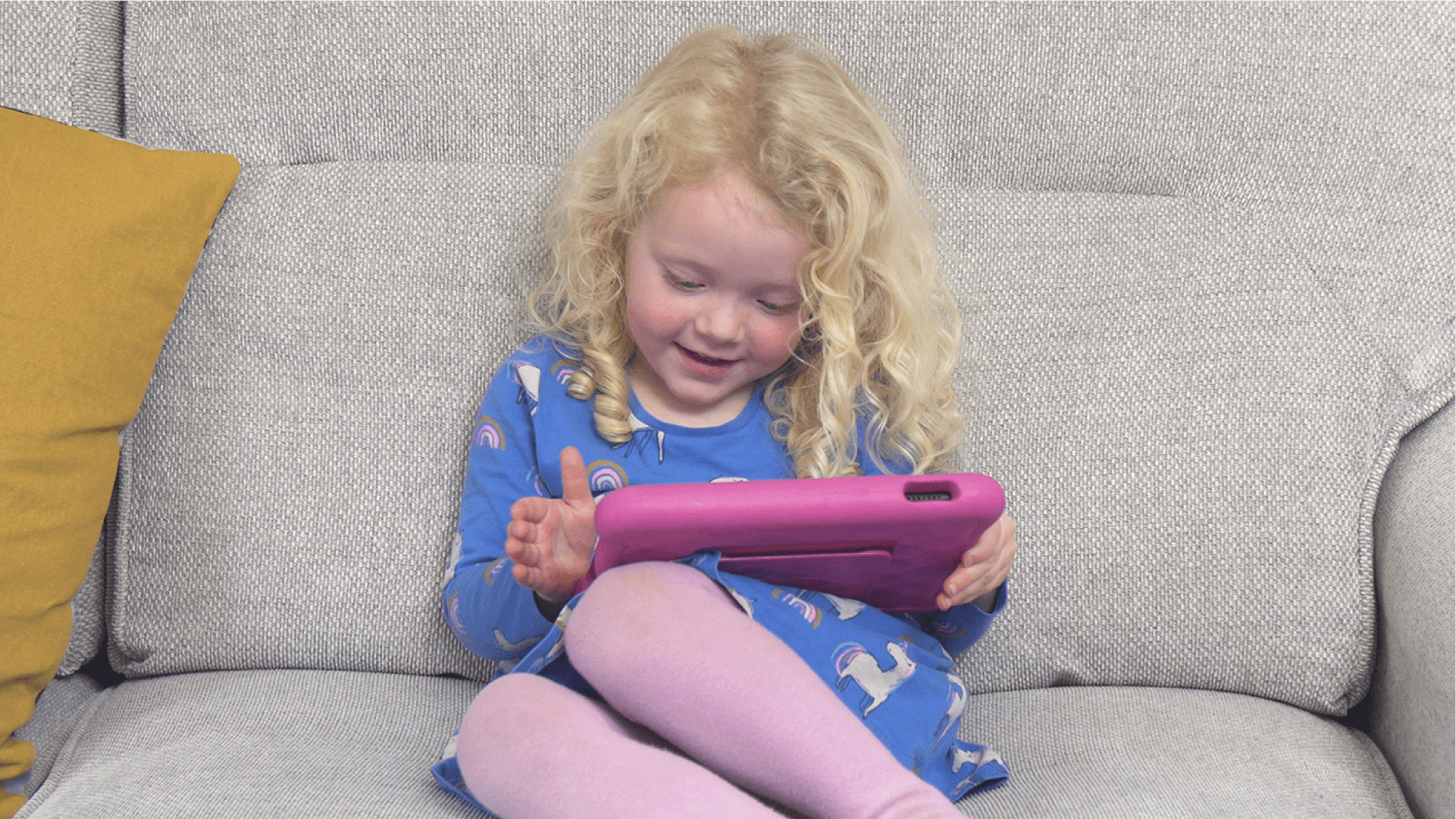 A child playing a maths game on a tablet