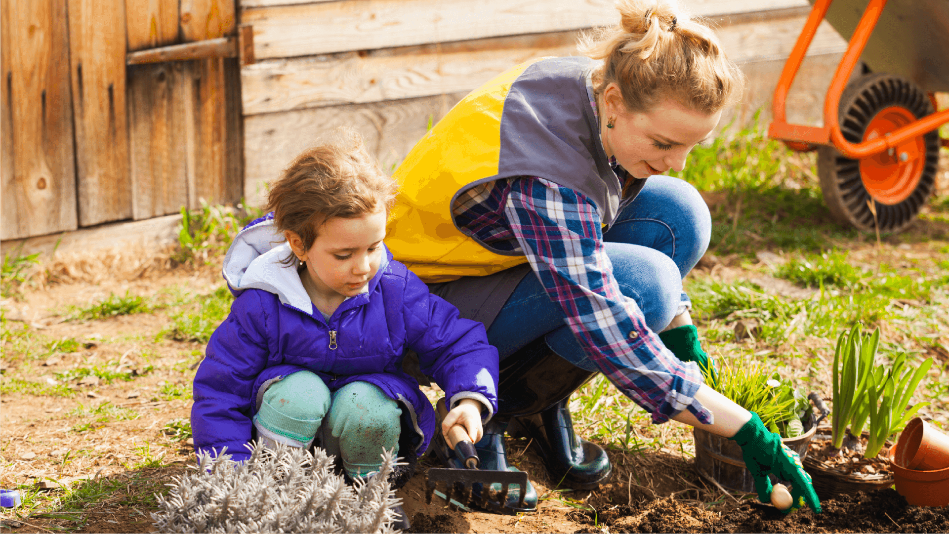 A mum and child gardening